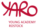 Rote Buchstaben in verschlungener Schrift