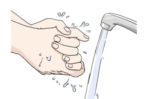 Hände werden unter einem laufenden Wasserhahn gewaschen