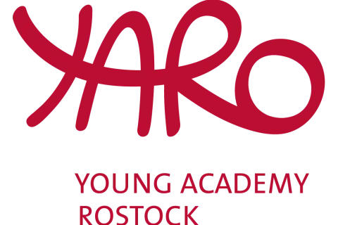 Rote Buchstaben in verschlungener Schrift